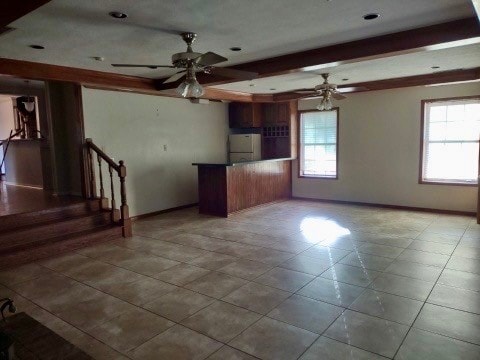 kitchen featuring white fridge and light tile patterned floors