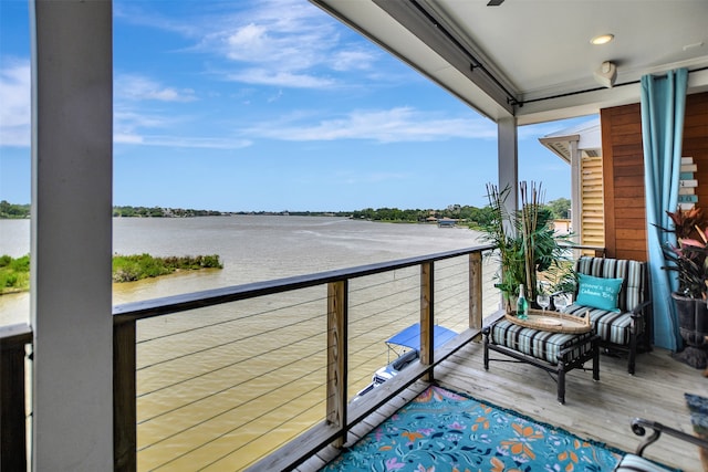 balcony featuring a water view