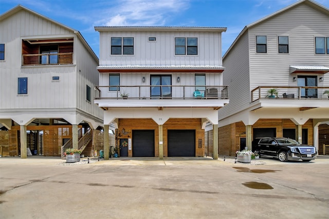 view of front of property with a carport, a balcony, and a garage