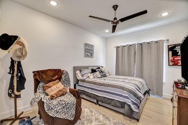 bedroom featuring light hardwood / wood-style flooring and ceiling fan