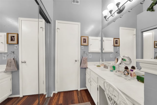 bathroom featuring wood-type flooring and vanity