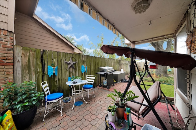 view of patio featuring a grill