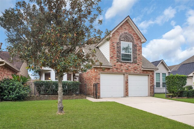 view of front property featuring a garage and a front lawn