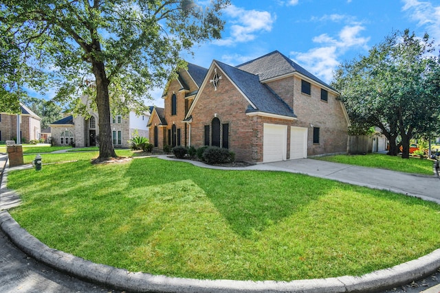 view of side of property with a yard and a garage