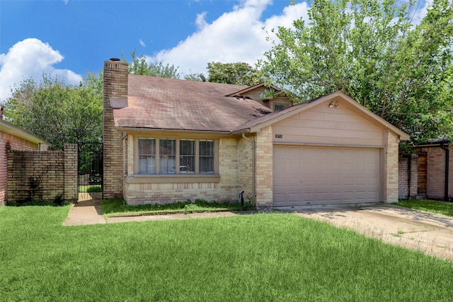 view of front of property featuring a front lawn and a garage