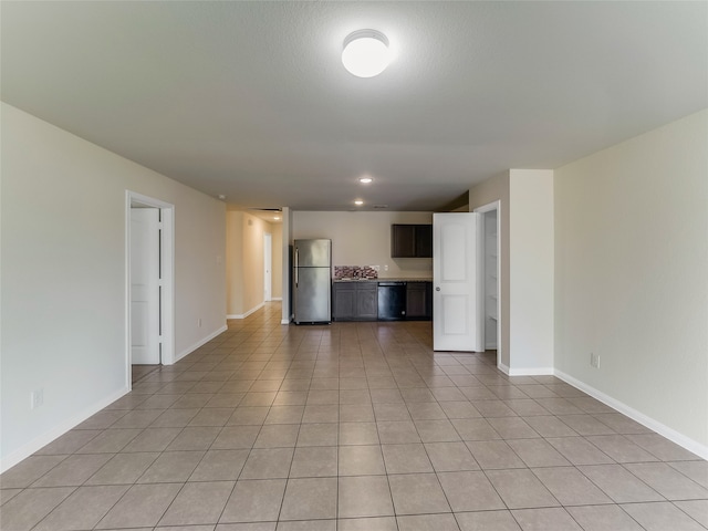 unfurnished living room with light tile patterned floors