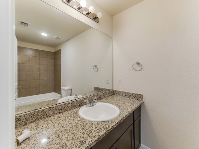 full bathroom featuring vanity, toilet, and independent shower and bath