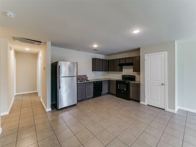 kitchen with dark brown cabinets, sink, light tile patterned floors, and black appliances