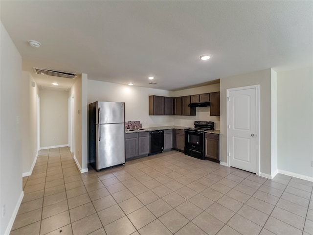 kitchen with black appliances, dark brown cabinets, light tile patterned flooring, and sink