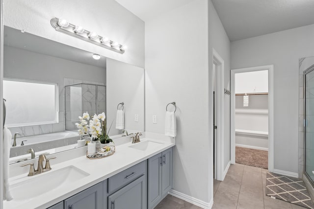 bathroom featuring vanity, separate shower and tub, and tile patterned floors