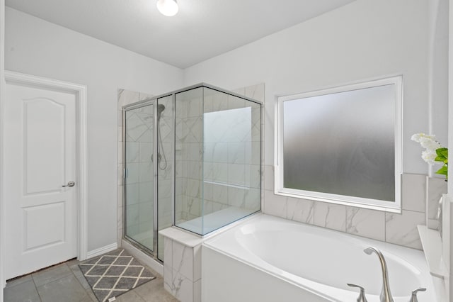 bathroom with plus walk in shower and tile patterned floors