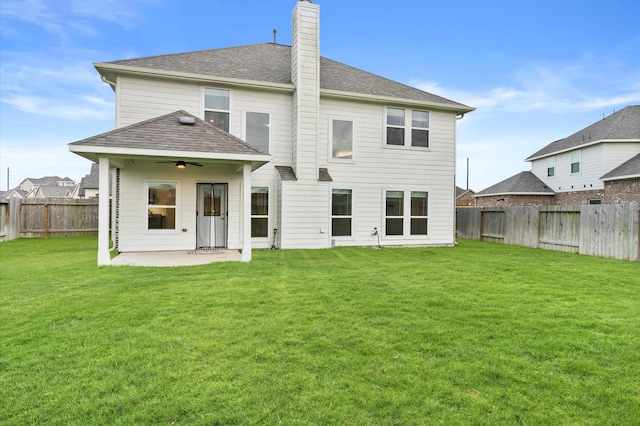 back of property featuring a patio and a lawn