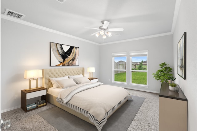 bedroom with ceiling fan, light carpet, and crown molding