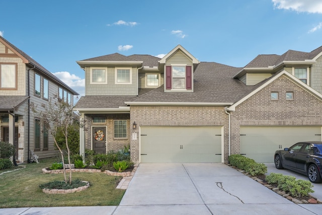 view of front of house featuring a front yard and a garage