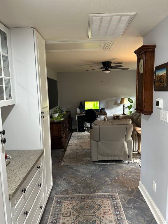 living room featuring ceiling fan