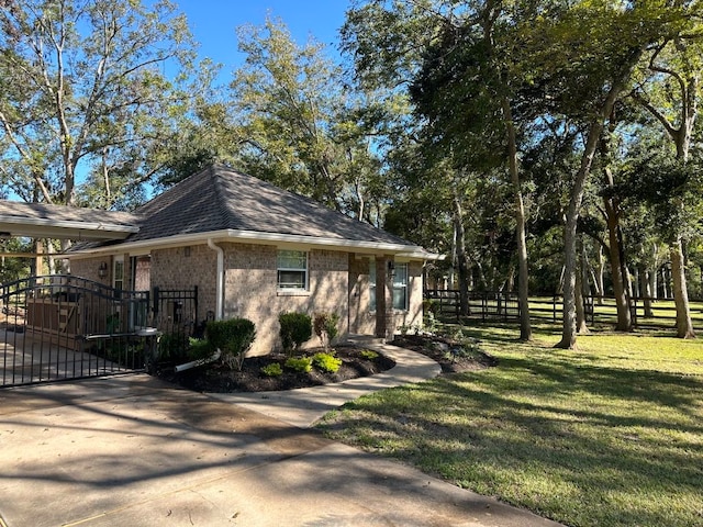 view of side of property featuring a yard