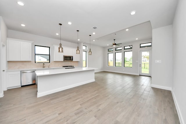 kitchen featuring visible vents, ceiling fan, recessed lighting, light countertops, and appliances with stainless steel finishes