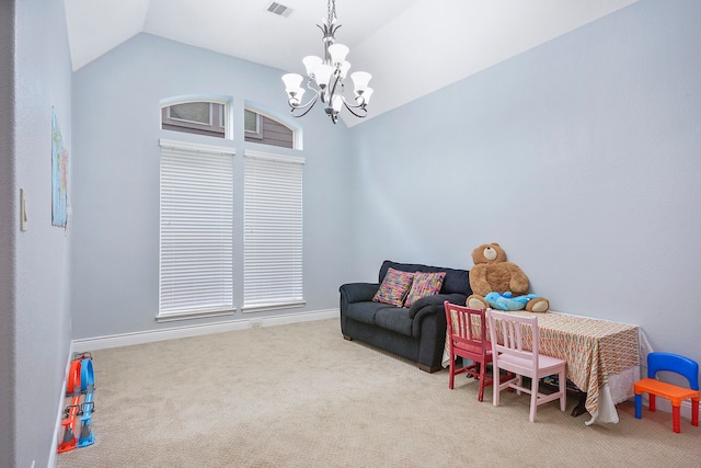 rec room featuring an inviting chandelier, light colored carpet, a wealth of natural light, and vaulted ceiling