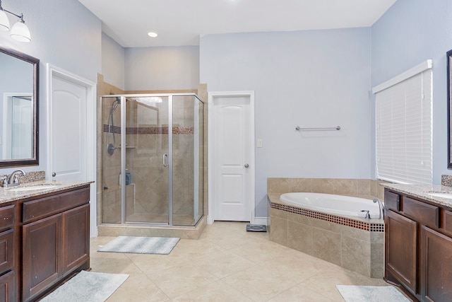 bathroom featuring vanity, shower with separate bathtub, and tile patterned flooring