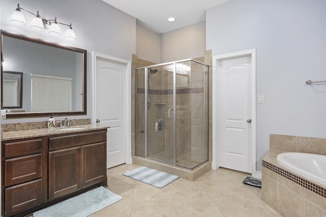 bathroom featuring vanity, plus walk in shower, and tile patterned floors