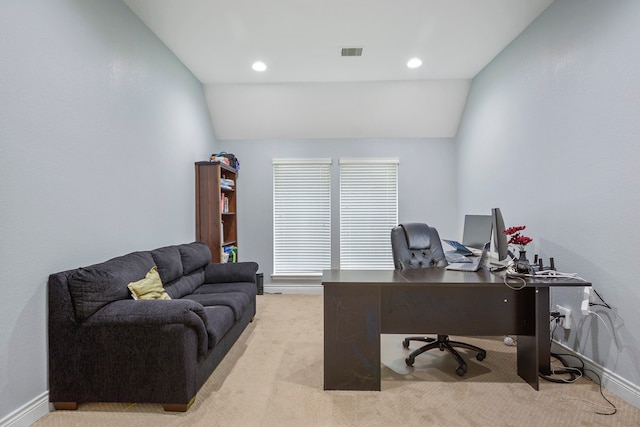 office area featuring light carpet and vaulted ceiling