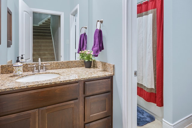 bathroom featuring vanity and a shower with shower curtain