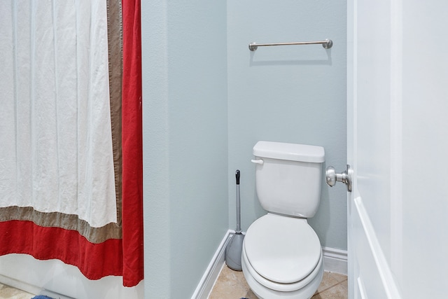 bathroom featuring tile patterned floors and toilet