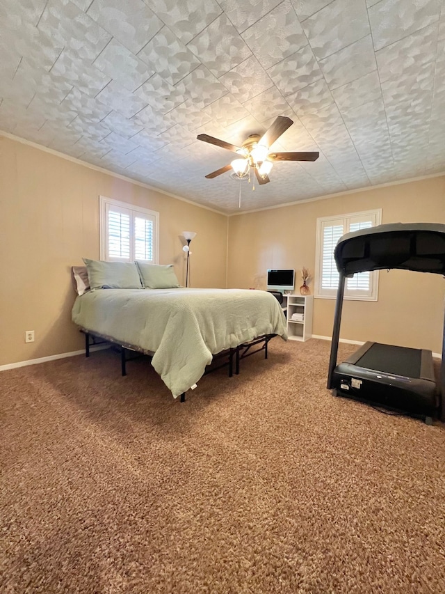 carpeted bedroom featuring ceiling fan and ornamental molding