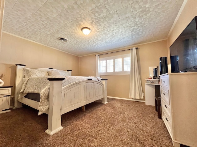 carpeted bedroom with a textured ceiling and crown molding