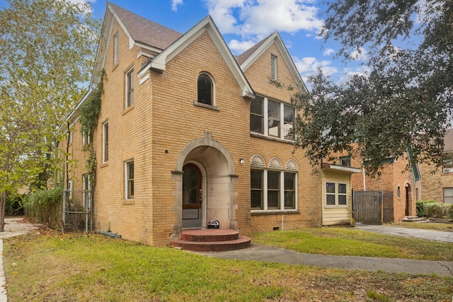 2409 Arbor St, Houston, TX 77004 - view of front facade featuring brick siding and a gate