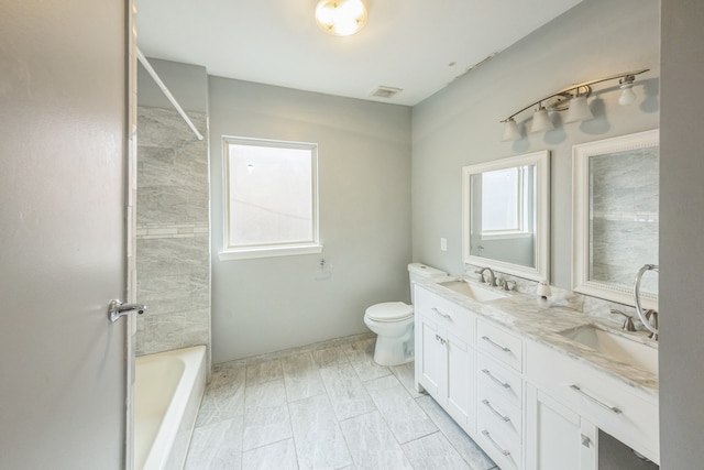 full bathroom with vanity, toilet, and shower / washtub combination