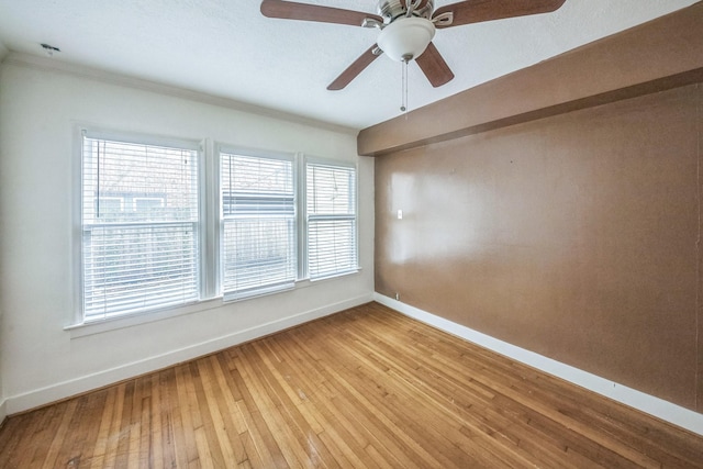 2409 Arbor St, Houston, TX 77004 - unfurnished room featuring baseboards, a ceiling fan, light wood finished floors, and ornamental molding
