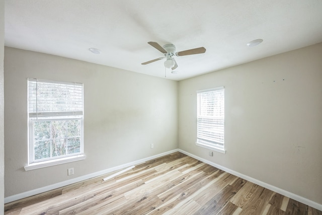 unfurnished room featuring light wood-type flooring and ceiling fan