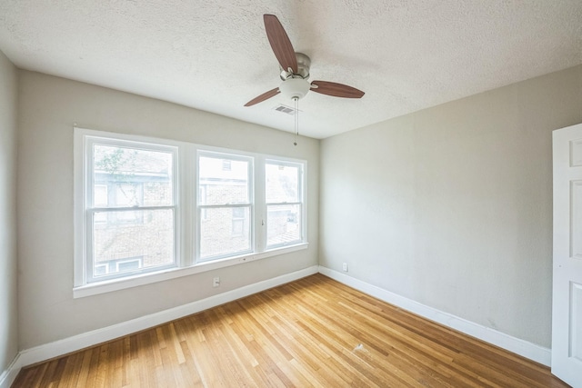 2409 Arbor St, Houston, TX 77004 - spare room featuring plenty of natural light, baseboards, and a textured ceiling