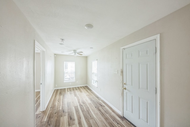 unfurnished room with light hardwood / wood-style floors and ceiling fan