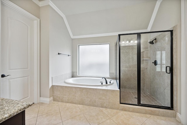 bathroom with tile patterned floors, ornamental molding, vanity, vaulted ceiling, and shower with separate bathtub