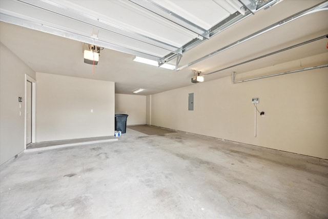 garage with electric panel and a garage door opener