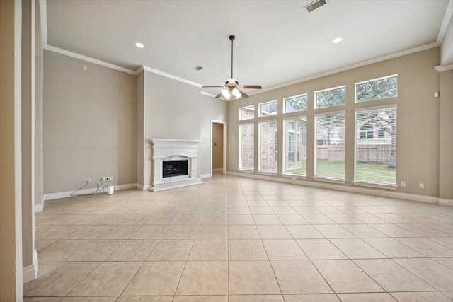 unfurnished living room featuring plenty of natural light, crown molding, and light tile patterned flooring