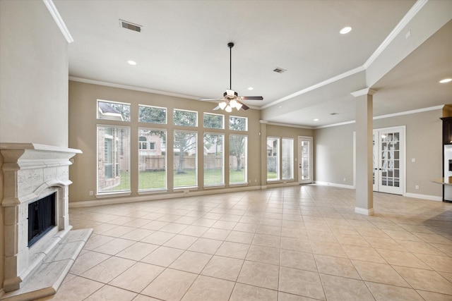 unfurnished living room with ceiling fan, light tile patterned flooring, ornamental molding, and a high end fireplace