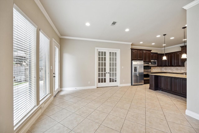 kitchen with backsplash, french doors, hanging light fixtures, dark brown cabinetry, and stainless steel appliances