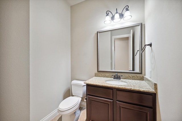 bathroom with tile patterned floors, vanity, and toilet