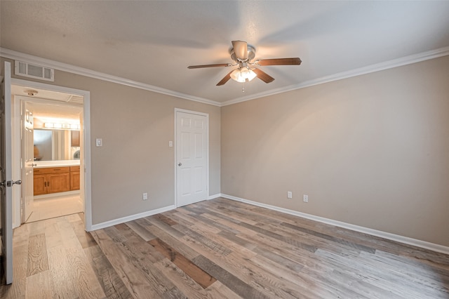 unfurnished bedroom with ceiling fan, light wood-type flooring, and ornamental molding