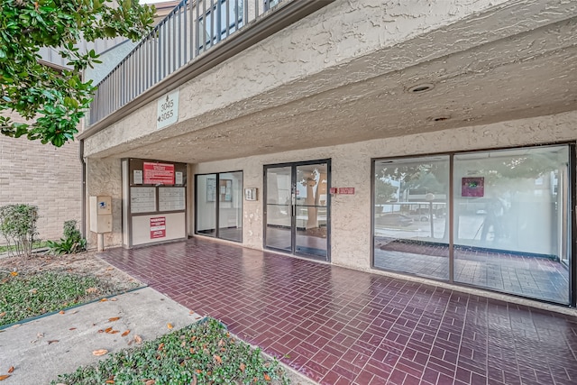 property entrance with a patio