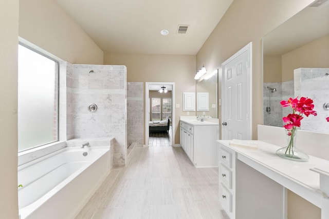 bathroom featuring vanity and a bathtub