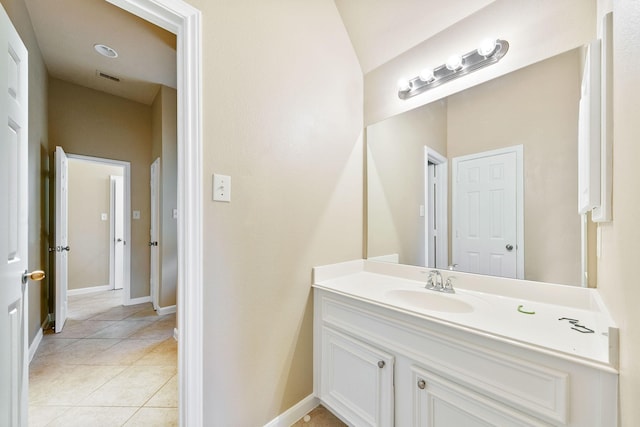 bathroom featuring tile patterned flooring and vanity