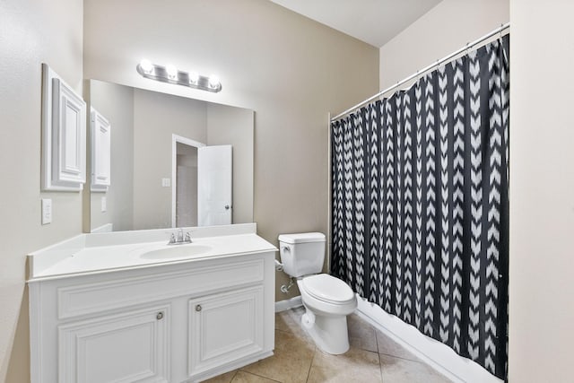 bathroom featuring tile patterned floors, vanity, and toilet