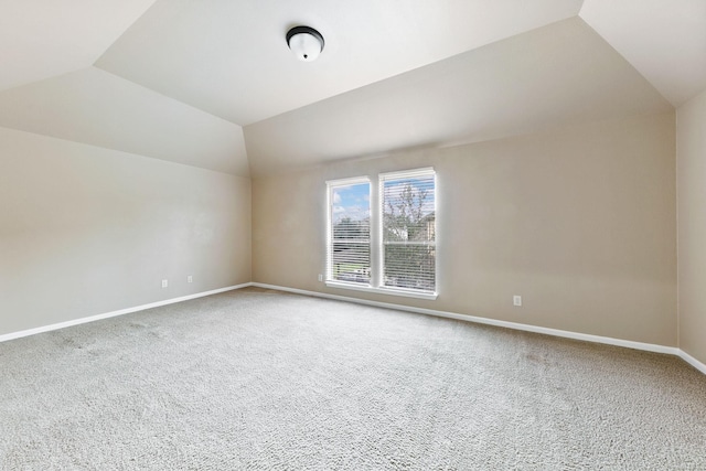 bonus room with carpet floors and lofted ceiling