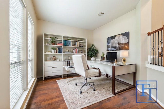 office space with dark hardwood / wood-style flooring