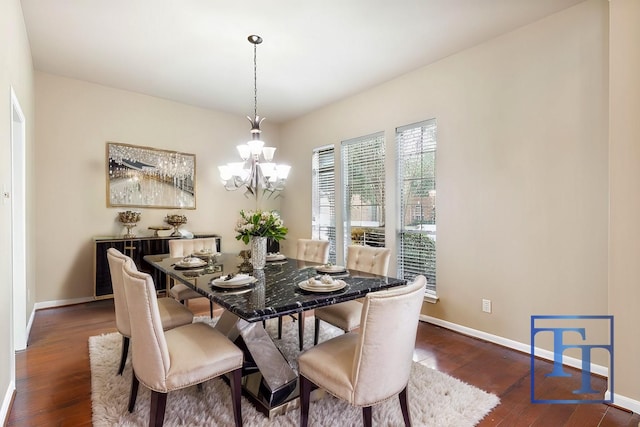 dining space featuring a notable chandelier and dark hardwood / wood-style flooring