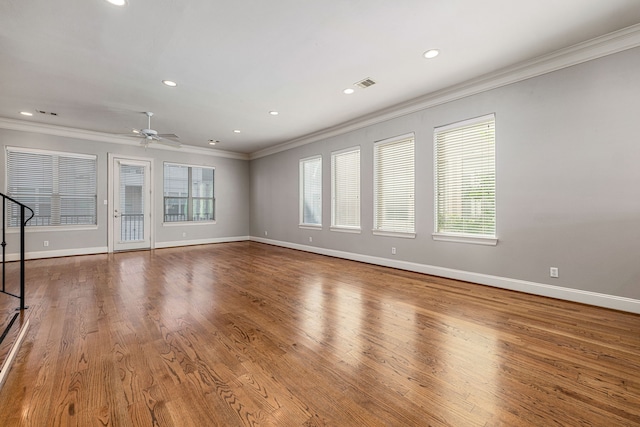 unfurnished living room with hardwood / wood-style floors, ceiling fan, and crown molding